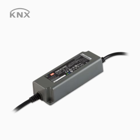 Produktbild vom LED Konstantspannungs-Netzteil PWM-60-KN mit Steuerleitung für KNX Signal, schwarzes Netzteil, freigestellt vor grauen Hintergrund