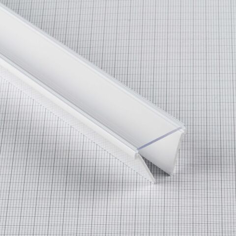 Produktbild der COEX Abdeckung in klar auf karierter Unterlage