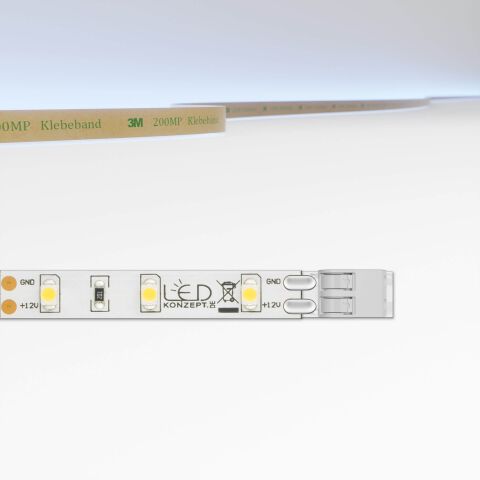 LED Streifen mit weißer Oberfläche und 5cm Modullänge und schematisch Darstellung der Lichtfarbe. Der Streifen ist mit dem Klemmsystem für LED Streifen ausgestattet